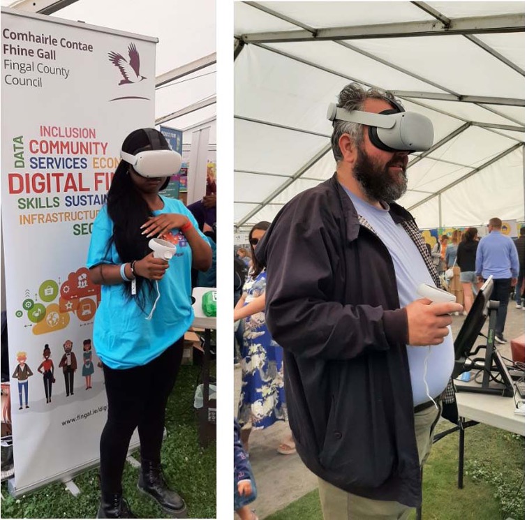 Two residents wearing VR headsets at a Fingal County Council stand, exploring the digital twin