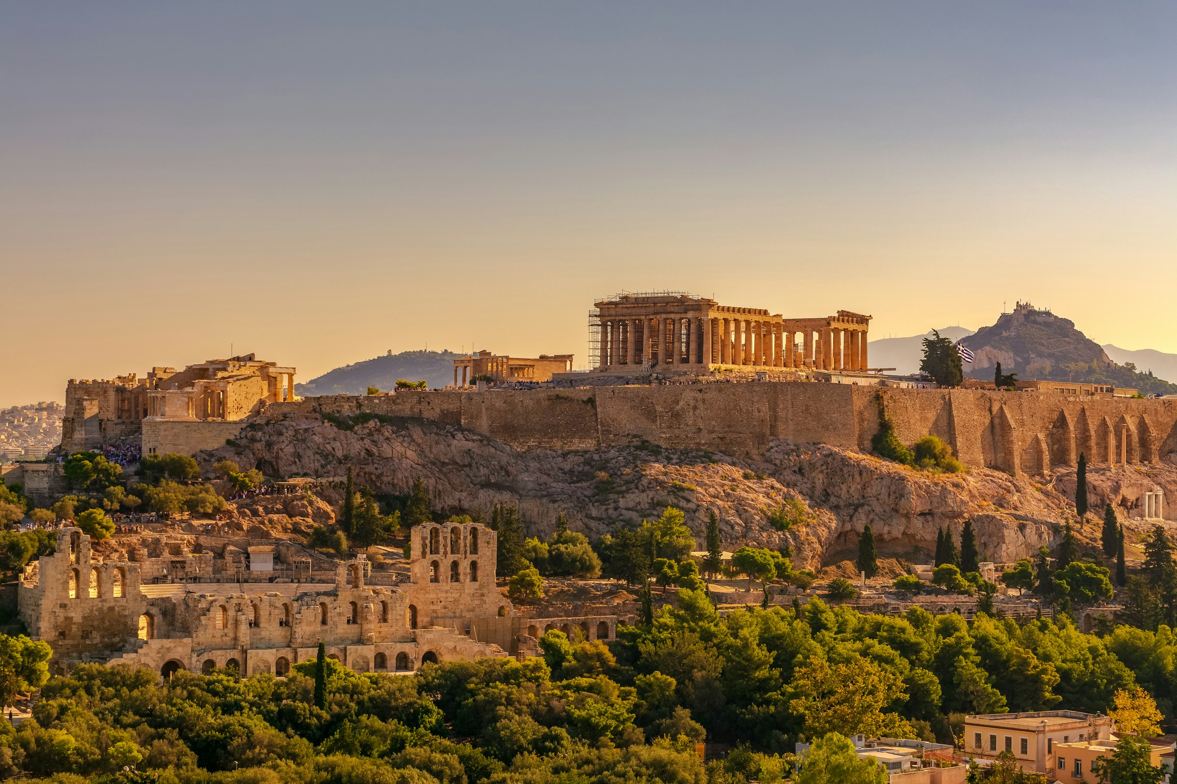 View of the Acropolis of Athens with the Parthenon and the Erechtheion from Filopappou hill at golden hour