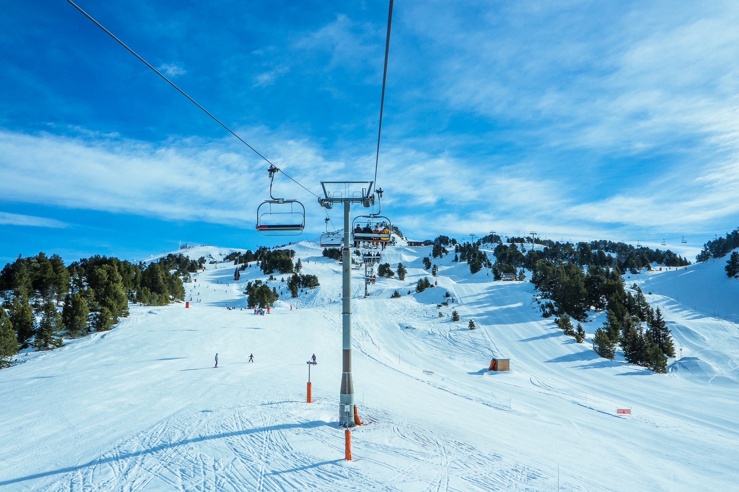 Ski lift against snowy mountains in Chamrousse